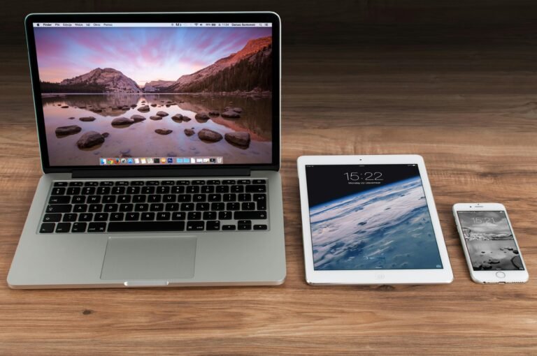 Macbook, iPad, and iPhone on a table