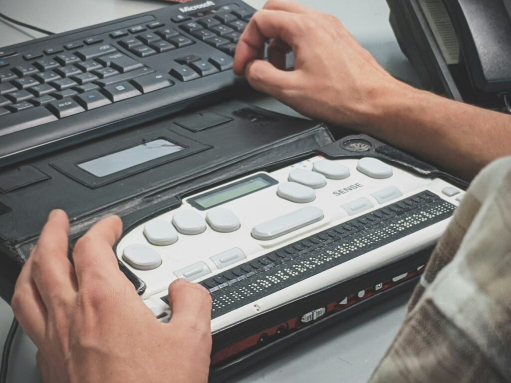 Person using a refreshable braille display